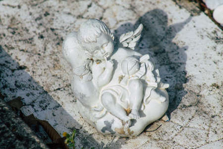 Reims France March 03, 2021 Religious objects of memories placed on the graves in the cemetery of the city of Reims during the coronavirus pandemic hitting Franceのeditorial素材