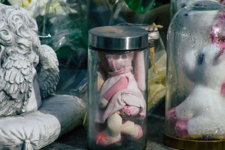 Reims France March 03, 2021 Religious objects of memories placed on the graves in the cemetery of the city of Reims during the coronavirus pandemic hitting Franceのeditorial素材