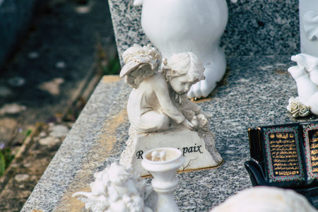 Reims France March 03, 2021 Religious objects of memories placed on the graves in the cemetery of...
