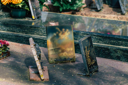 Reims France March 03, 2021 Religious objects of memories placed on the graves in the cemetery of the city of Reims during the coronavirus pandemic hitting Franceのeditorial素材