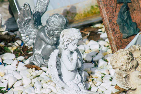 Reims France March 03, 2021 Religious objects of memories placed on the graves in the cemetery of the city of Reims during the coronavirus pandemic hitting Franceのeditorial素材