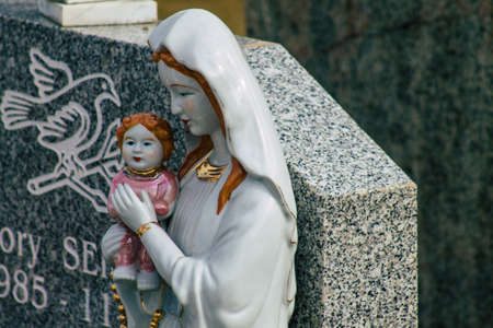 Reims France March 03, 2021 Religious objects of memories placed on the graves in the cemetery of...