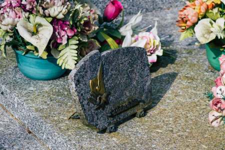 Reims France March 03, 2021 Religious objects of memories placed on the graves in the cemetery of the city of Reims during the coronavirus pandemic hitting Franceのeditorial素材