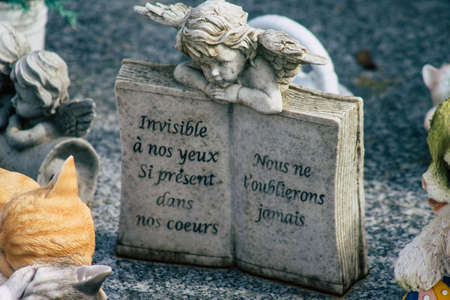 Reims France March 03, 2021 Religious objects of memories placed on the graves in the cemetery of the city of Reims during the coronavirus pandemic hitting Franceのeditorial素材