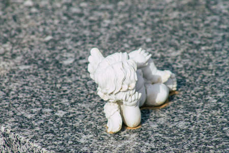 Reims France March 03, 2021 Religious objects of memories placed on the graves in the cemetery of the city of Reims during the coronavirus pandemic hitting Franceのeditorial素材
