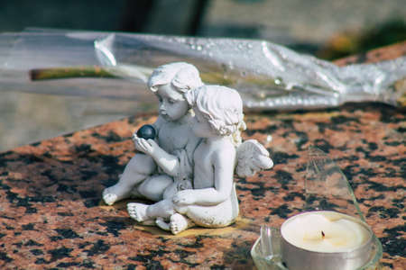 Reims France March 03, 2021 Religious objects of memories placed on the graves in the cemetery of the city of Reims during the coronavirus pandemic hitting Franceのeditorial素材