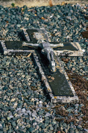 Reims France March 03, 2021 Religious objects of memories placed on the graves in the cemetery of...