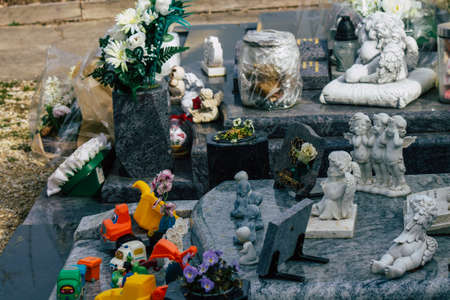 Reims France March 03, 2021 Religious objects of memories placed on the graves in the cemetery of the city of Reims during the coronavirus pandemic hitting Franceのeditorial素材