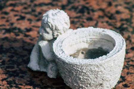 Reims France March 03, 2021 Religious objects of memories placed on the graves in the cemetery of the city of Reims during the coronavirus pandemic hitting Franceのeditorial素材