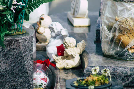 Reims France March 03, 2021 Religious objects of memories placed on the graves in the cemetery of the city of Reims during the coronavirus pandemic hitting Franceのeditorial素材