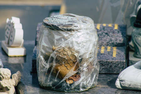 Reims France March 03, 2021 Religious objects of memories placed on the graves in the cemetery of the city of Reims during the coronavirus pandemic hitting Franceのeditorial素材