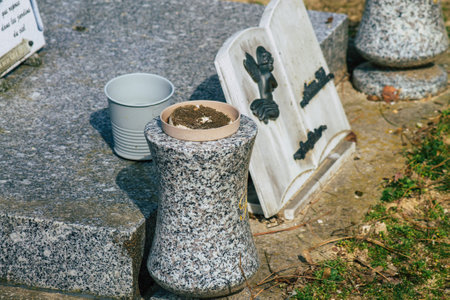 Reims France March 03, 2021 Religious objects of memories placed on the graves in the cemetery of the city of Reims during the coronavirus pandemic hitting Franceのeditorial素材