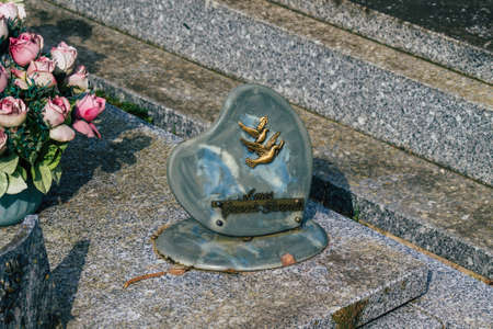 Reims France March 03, 2021 Religious objects of memories placed on the graves in the cemetery of the city of Reims during the coronavirus pandemic hitting Franceのeditorial素材