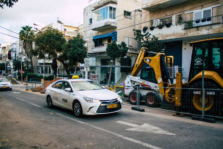 Tel Aviv Israel March 02, 2021 Israeli taxi driving through the streets of Tel Aviv during the lockdown of the city and the Coronavirus outbreak hitting Israelのeditorial素材