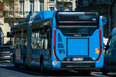 Reims France March 29, 2021 City bus for passengers driving through the streets during coronavirus outbreak hitting France and part of the public transport system of Reimsのeditorial素材