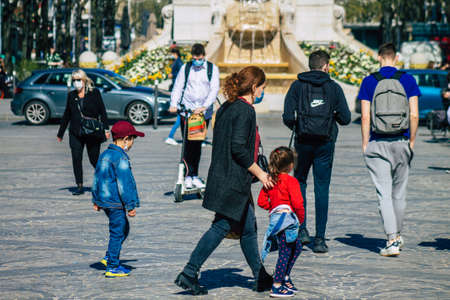 Reims France April 1, 2021 Pedestrians with a face mask to protect themself from the coronavirus walking in the streets of Reims during Coronavirus pandemic affecting Franceのeditorial素材