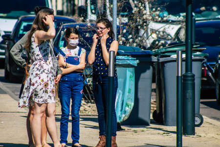 Reims France April 1, 2021 Pedestrians with a face mask to protect themself from the coronavirus...