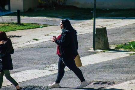 Reims France April 08, 2021 Pedestrians walking in the streets of Reims during the coronavirus...