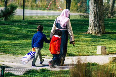 Reims France April 08, 2021: Pedestrians walking in the streets of Reims during the outbreak hitting...