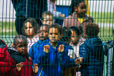 Reims France May 04, 2021 Kids at the elementary school excited to see French fire fighter in intervention in the streets of Reims during the coronavirus outbreak hitting Franceのeditorial素材