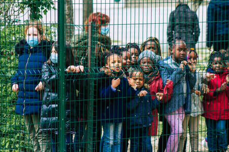 Reims France May 04, 2021 Kids at the elementary school excited to see French fire fighter in intervention in the streets of Reims during the coronavirus outbreak hitting Franceのeditorial素材