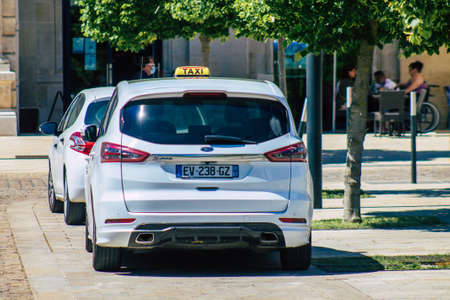 Reims France June 11, 2021 Taxi driving in the streets of Reims during the coronavirus epidemic, people prefer this type of transport so as not to be contaminated, wearing a mask is mandatoryのeditorial素材