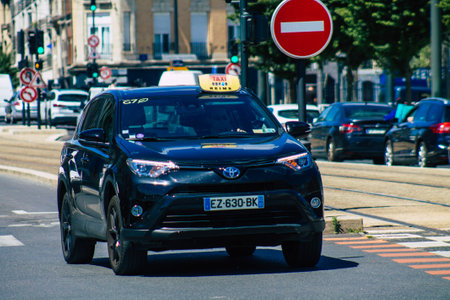 Reims France June 11, 2021 Taxi driving in the streets of Reims during the coronavirus epidemic, people prefer this type of transport so as not to be contaminated, wearing a mask is mandatoryのeditorial素材