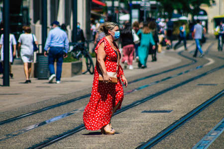 Reims France June 11, 2021 Pedestrians walking in the streets of Reims during the coronavirus outbreak hitting France, wearing a mask in the street is mandatoryのeditorial素材