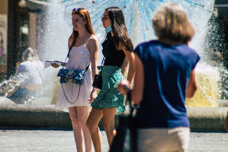 Reims France June 11, 2021 Pedestrians walking in the streets of Reims during the coronavirus outbreak hitting France, wearing a mask in the street is mandatoryのeditorial素材