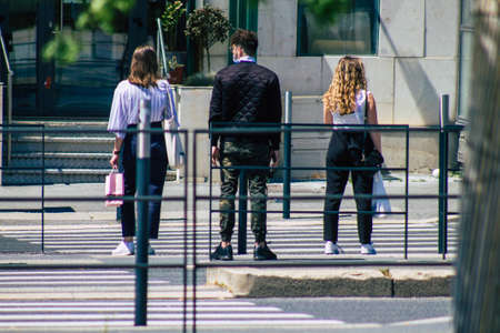 Reims France June 11, 2021 Pedestrians walking in the streets of Reims during the coronavirus outbreak hitting France, wearing a mask in the street is mandatoryのeditorial素材