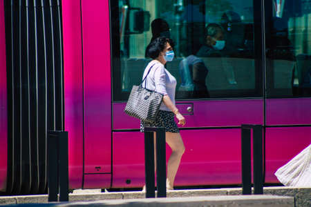 Reims France June 11, 2021 Pedestrians walking in the streets of Reims during the coronavirus outbreak hitting France, wearing a mask in the street is mandatoryのeditorial素材