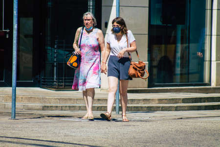 Reims France June 11, 2021 Pedestrians walking in the streets of Reims during the coronavirus outbreak hitting France, wearing a mask in the street is mandatoryのeditorial素材