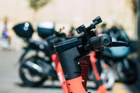 Seville Spain July 01, 2021 Electric scooter to rent parked in the streets of Seville, operating...