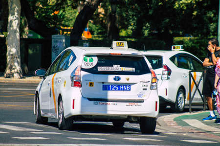 Seville Spain July 01, 2021 Taxi driving through the streets of Seville, an emblematic city and the capital of the region of Andalusia, in the south of Spainのeditorial素材