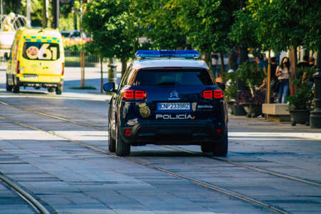 Seville Spain July 02, 2021 Police car patrolling in the streets of Seville, an emblematic city and the capital of the region of Andalusia, in the south of Spainの写真素材
