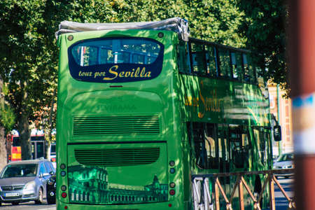 Seville Spain July 02, 2021 Tourist bus driving through the streets of Seville, an emblematic city...