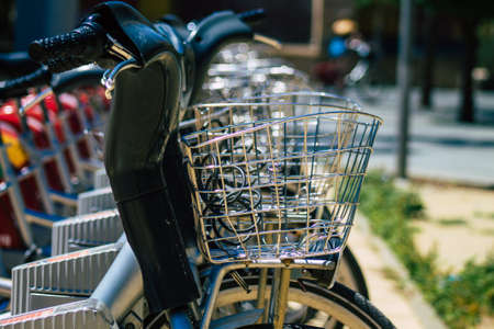 Seville Spain July 02, 2021 Accessible bicycles to hire for short periods of time, usually for a few hours parked in the street and part of the public transport system of Sevilleの写真素材