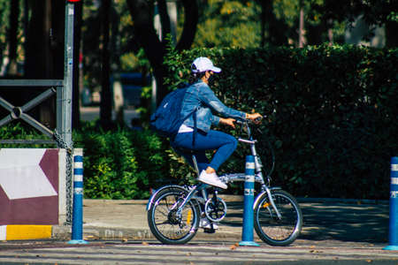 Seville Spain July 02, 2021 People rolling with bicycle in the streets of Seville, an emblematic...