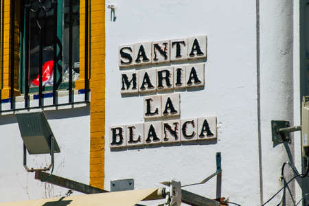 Seville Spain July 02, 2021 Street sign or road sign, erected at the side of or above roads to provide information to road user in the downtown area of Sevilleの写真素材
