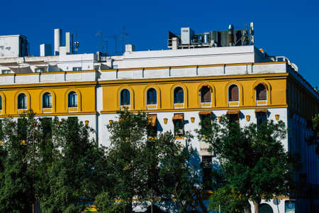 Seville Spain July 02, 2021 Facade of a building in the streets of Seville, an emblematic city and the capital of the region of Andalusia, in the south of Spainのeditorial素材