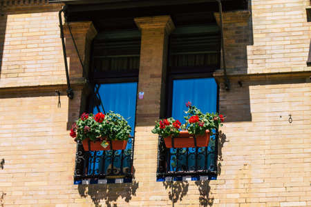 Seville Spain July 02, 2021 Facade of a building in the streets of Seville, an emblematic city and the capital of the region of Andalusia, in the south of Spainのeditorial素材