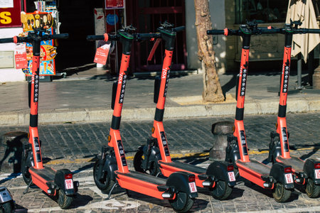 Seville Spain July 02, 2021 Electric scooter to rent parked in the streets of Seville, operating...
