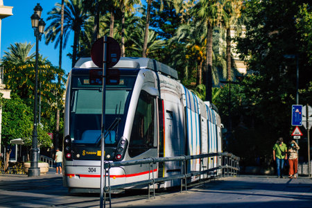 Seville Spain July 04, 2021 Modern electric tram for passengers rolling through the streets of Seville, an emblematic city and the capital of the region of Andalusia, in the south of Spainのeditorial素材