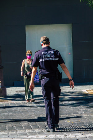 Seville Spain July 05, 2021 Local police officer in the streets of Seville, an emblematic city and...