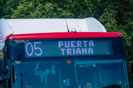 Seville Spain July 06, 2021 Bus driving through the streets of Seville, an emblematic city and the...
