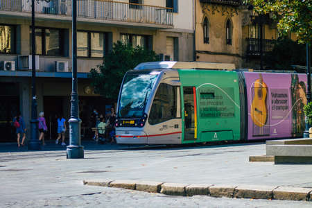 Seville Spain July 06, 2021 Modern electric tram for passengers rolling through the streets of Seville, an emblematic city and the capital of the region of Andalusia, in the south of Spainの写真素材