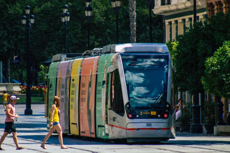 Seville Spain July 06, 2021 Modern electric tram for passengers rolling through the streets of Seville, an emblematic city and the capital of the region of Andalusia, in the south of Spainの写真素材