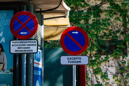 Seville Spain July 06, 2021 Street sign or road sign, erected at the side of or above roads to provide information to road user in the downtown area of Sevilleの写真素材