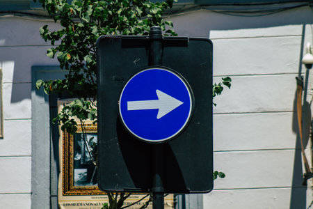 Seville Spain July 06, 2021 Street sign or road sign, erected at the side of or above roads to provide information to road user in the downtown area of Sevilleの写真素材