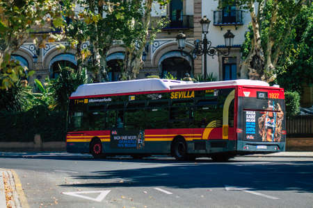 Seville Spain July 09, 2021 Bus driving through the streets of Seville, an emblematic city and the...